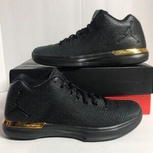 Nike Black Mid-Top Athletic Sneakers with Gold Accent